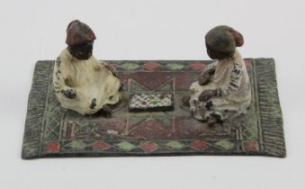 After Franz Bergmann. Cold painted bronze, depicting two figures sat on a carpet, height 40mm,