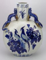 A large Chinese blue and white moon flask depicting phoenix and flowers porcelain twin handled