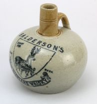 Balderson's whisky jug. Approx 14.5 cm tall with tan neck and ivory coloured glaze. Black