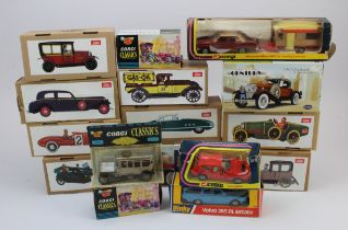 Diecast & Tinplate. A group of sixteen boxed diecast and tinplate model cars, including Dinky