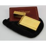 S. T. Dupont gold plated lighter, comes with original guarantee card