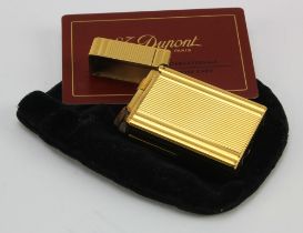 S. T. Dupont gold plated lighter, comes with original guarantee card