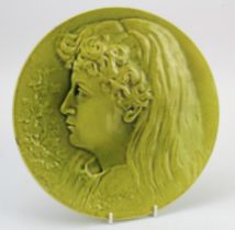 Burmantofts Faience wall plaque (1011), depicting a female portrait, signed P. Mallet, diameter 27cm