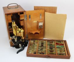Brass & black lacquered microscope by E. Leitz Wetzlar (no. 113139), with documentation, height 29cm