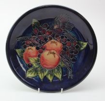 Moorcroft 'Finches & Fruit' pattern plate, makers marks to reverse, diameter 26cm approx.