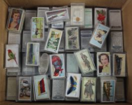 Box with approx 80x full sets of cigarette cards (not checked) loose in small plastic cases. G-VG