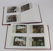 Bamforth Song cards, 2 red albums housing original collection, sets & part sets (approx 203 cards)