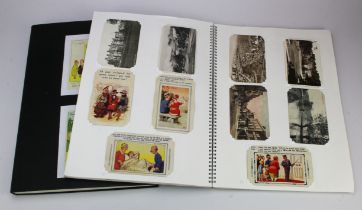 GB topo and Comic postcards housed in 2x large black albums (approx 300)
