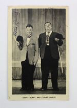 Stan Laurel & Oliver Hardy black & white promotional photograph, signed by both, 88mm x 140mm