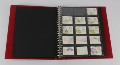 GB - red binder housing a small Booklet collection, mostly 1970's to mid 1980's, except for 2x