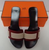 Designer Shoes, a pair of Hermes slip on sandals with wood effect soles and linen and leather