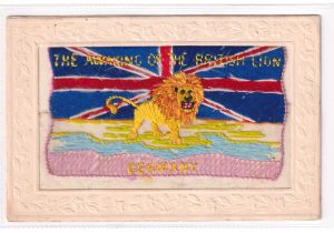 Postcard, Silks, a scarce patriotic embroidered silk card showing a lion standing on the South Coast