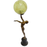 An Art Deco lamp - the semi nude spelter figure with a gilt finish raised holding a yellow marbled