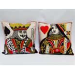 A contemporary embroidered cushion - decorated with the Queen of Hearts, together with another