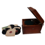 An HMV table grand gramophone - with light brown oak case, together with eight 78rpm records.