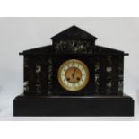 An early 20th century black slate and green marble portico clock - the ivorine dial set out in