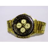 A Seiko Chronograph Rotary Slide Rule Sports 150 - a gilt steel case, the black dial with dots and