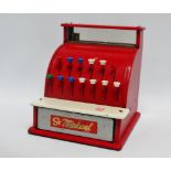 A child's cash register, red and cream, pre decimal.