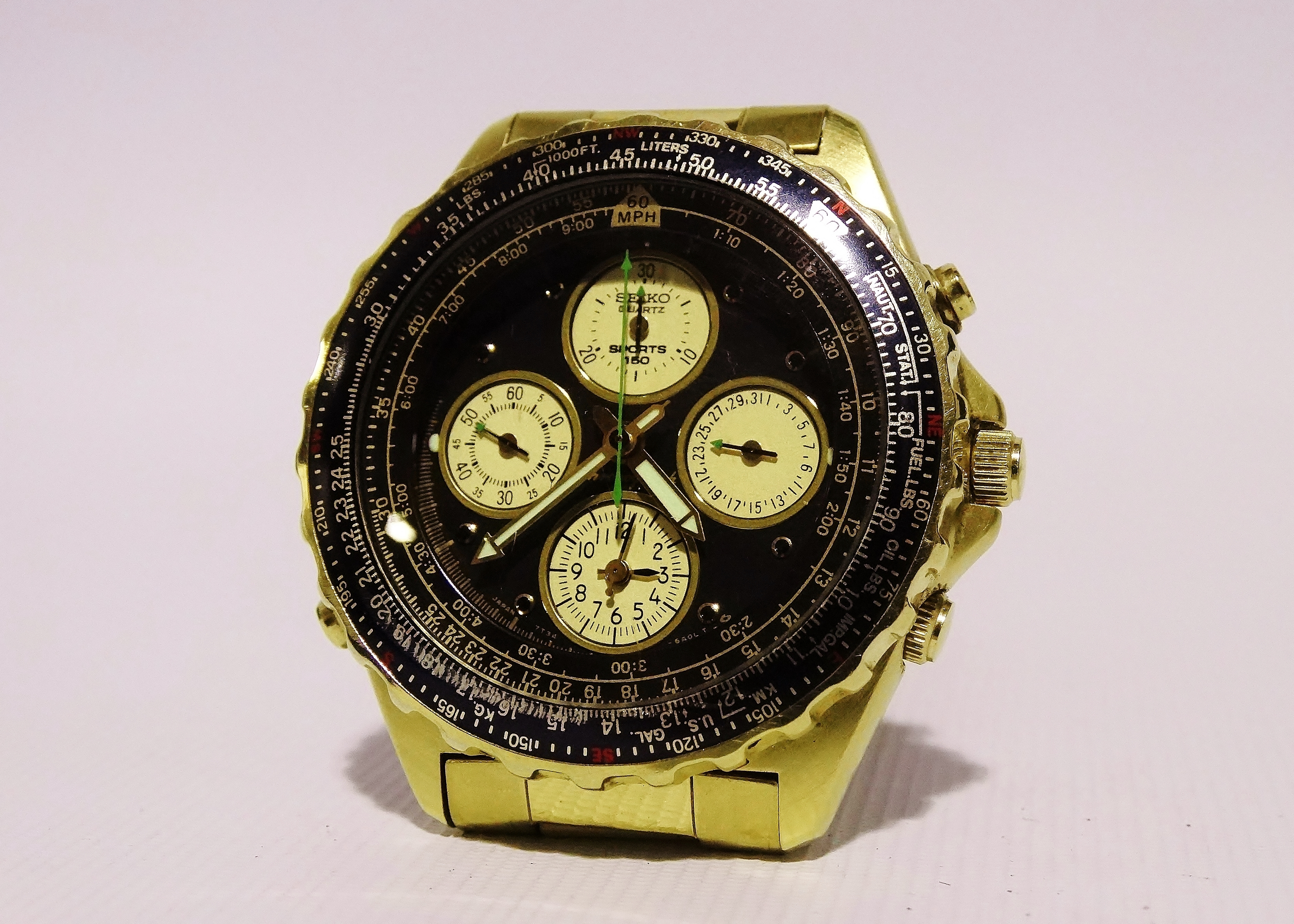 A Seiko Chronograph Rotary Slide Rule Sports 150 - a gilt steel case, the black dial with dots and - Image 3 of 6