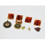 Four mid 20th century amber coloured square buttons - together with two Chinese pendants and two