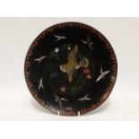 An early 20th century Japanese cloisonne charger - decorated with birds on a black ground,