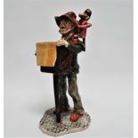 Will Young for Runnaford Pottery - hurdy-gurdy man with monkey, signed to base, height 22cm