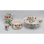 A Maling wash jug and bowl - with tooth brush mug and bed pan, decorated with poppies, (4)
