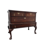 A George II and later oak chest on stand - the rectangular top above an arrangement of two short and