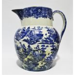 A large 19th century blue and white transfer printed jug - decorated with oriental scenes, height