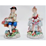 A pair of early 20th century German figures - gallant with flower basket and a similar maid,