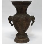 A Meiji period bronze vase - of baluster form decorated with dragons with a flaming pearl and