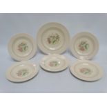A Susie Cooper part service - comprising five sandwich plates and one large serving plate, with