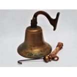 A large early 20th century ship's bell - of typical form and including bracket and clapper, height