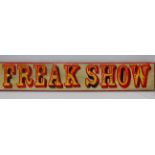 A showman's wooden painted sign 'Freak Show', 106 x 19cm.