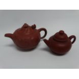 A Chines YiXing terracotta teapot - modelled with clouds and dragons, width 20cm, together with