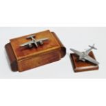 An Art Deco walnut cigarette box - mounted with a chrome plated twin engined aircraft, width 22cm,