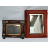 A William IV rosewood framed wall mirror - the rectangular plate within split turned columns and