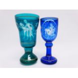 An erotic blue glass goblet - engraved with a couple in an embrace, height 20cm, together with