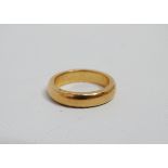 A 22ct yellow gold wedding band - weight 7.5g, size J.