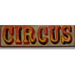 A showman's wooden painted sign 'Circus', 66 x 19cm.