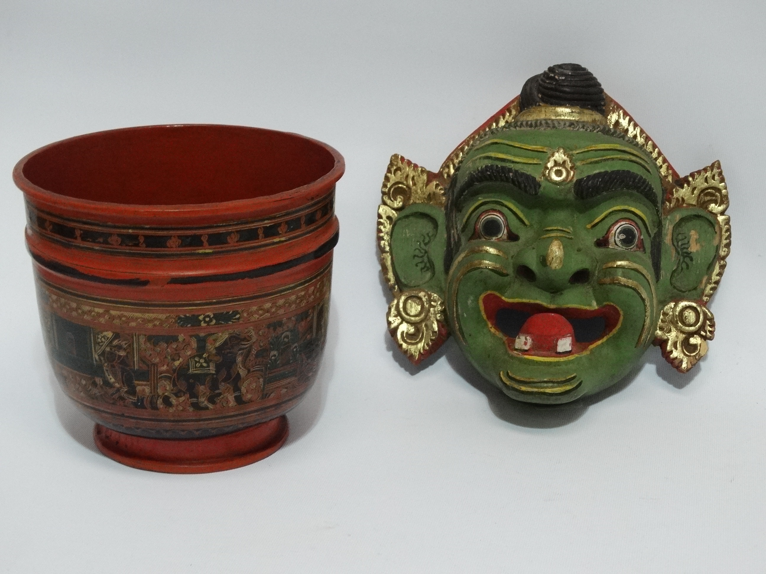 An Indonesian mask - green with gilt decoration, height 24cm, together with a papier mache bowl,