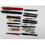 An oversized fountain pen - together with another and a quantity of 20th century fountain pens, some