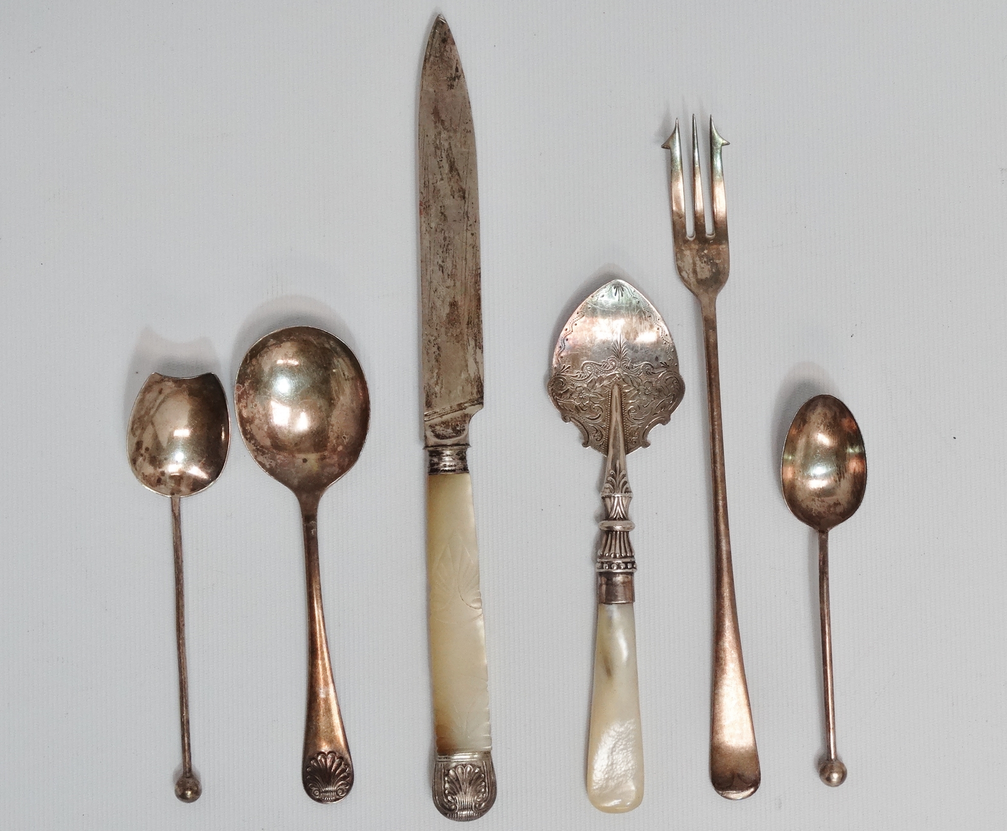 A silver jam spoon with mother-of-pearl handle - Birmingham 1886, the blade with foliate