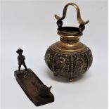 A late 19th century bronze desk tidy - modelled as a micturating young boy with a goose looking