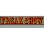 A showman's wooden painted sign 'Freak Show', 106 x 19cm.