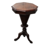 Victorian walnut sewing table - of octagonal tapering form with tripod base ending in carved