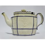 A late 19th century creamware teapot - decorated with floral panels and classical scenes, height
