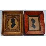 An early 19th Century silhouette portrait of a gentleman - with high collar and framed as an oval,