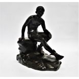 After the Antique - a 19th century cast and patinated bronze study of Mercury seated on a rocky