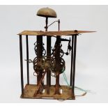 An 18th century turret clock movement - with wrought iron and brass two train movement striking a